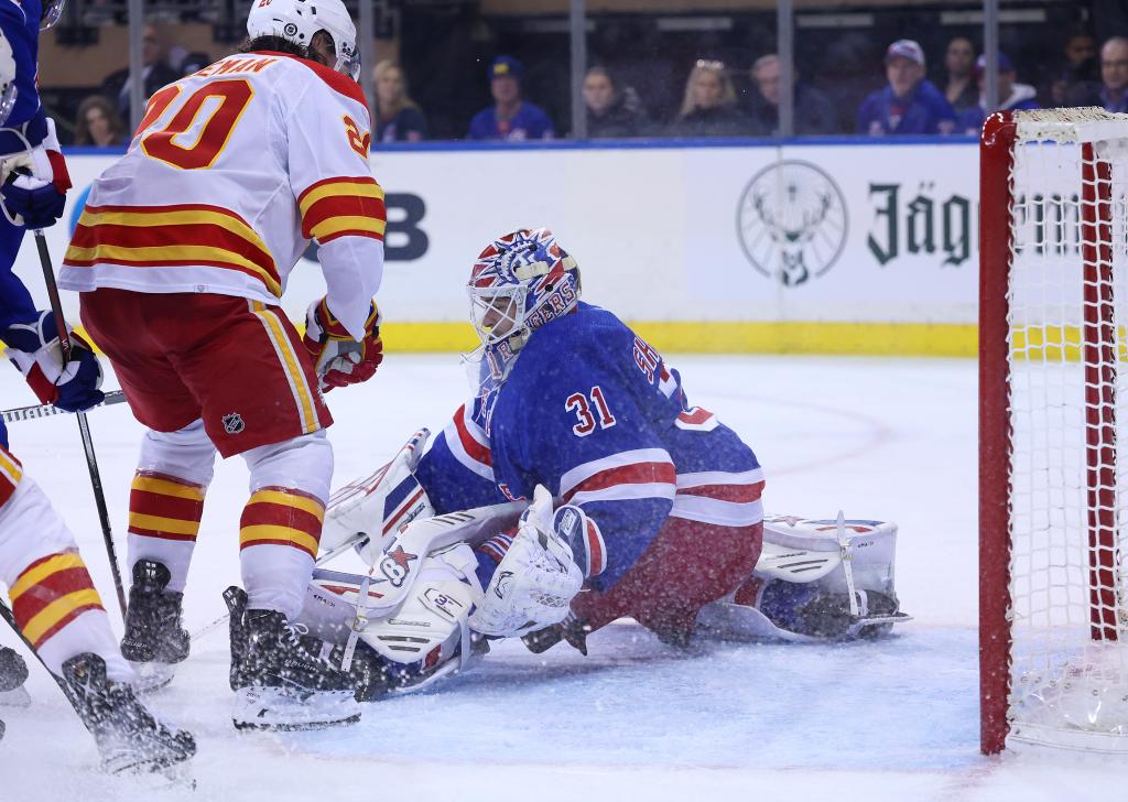 Igor Shesterkin makes a save against the Flames on Monday night.