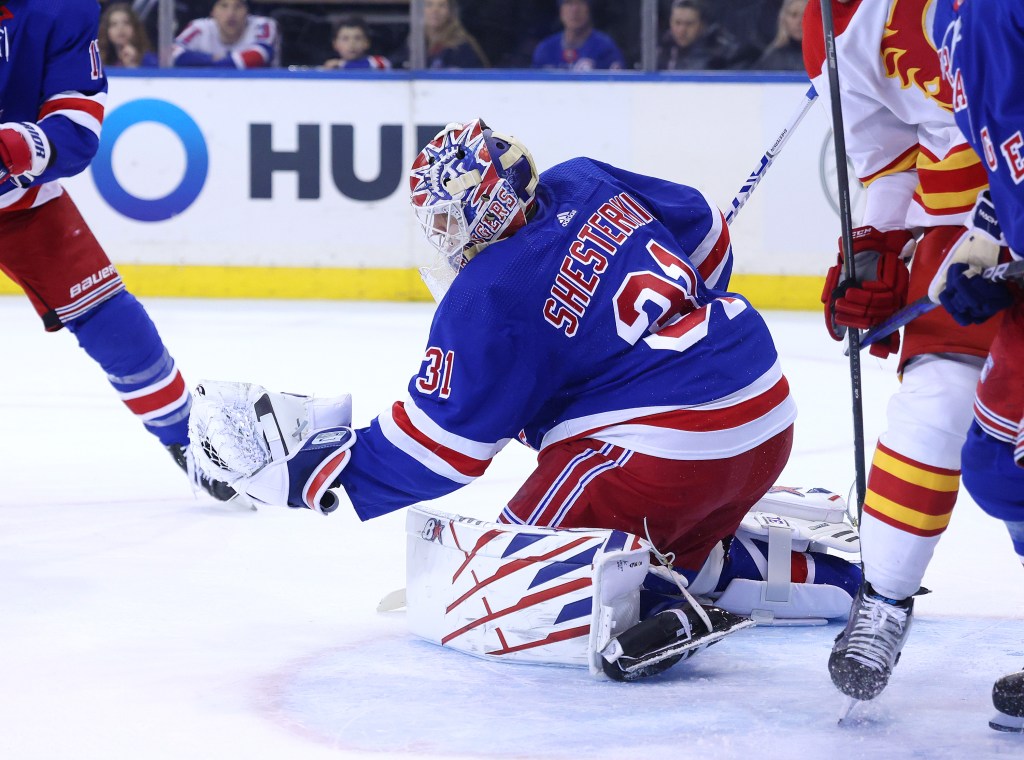 Igor Shesterkin makes a save for the Rangers against the Flames Monday.