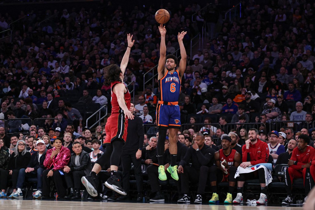 Quentin Grimes makes a three point basket as Miami Heat guard Jaime Jaquez Jr. (11) defends during the second half at Madison Square Garden.