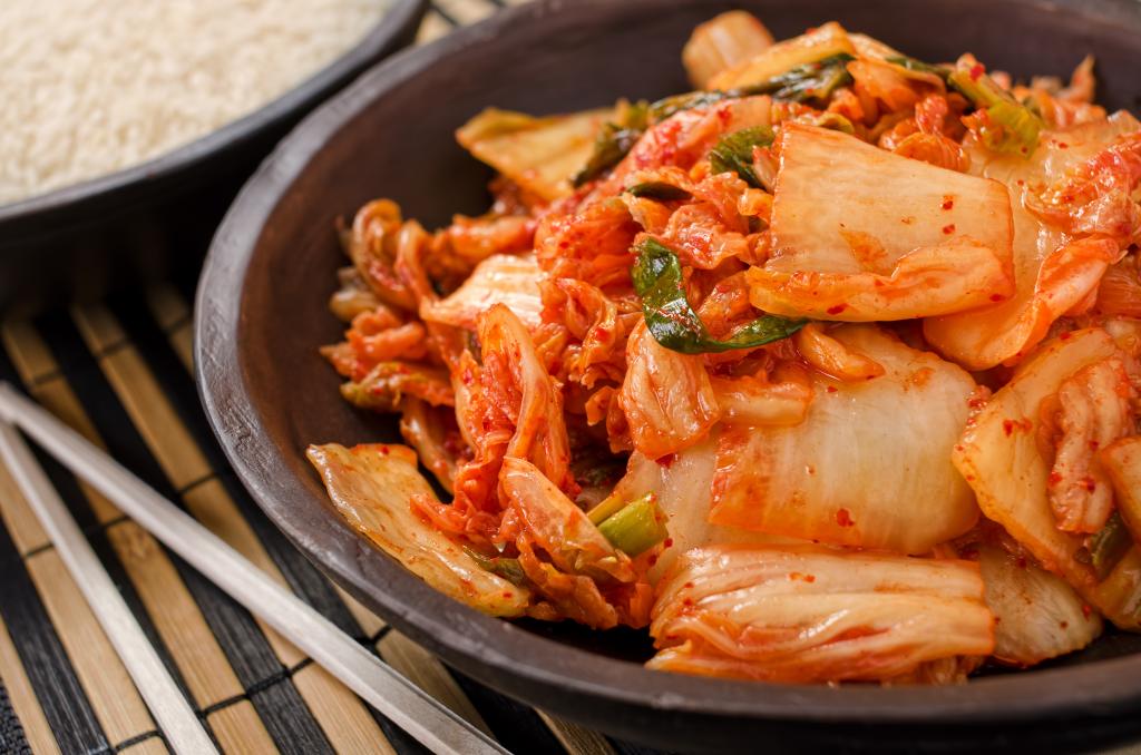 Bowl of kimchi on table.