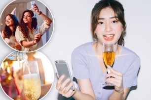 A woman holding a glass of champagne and a cell phone,