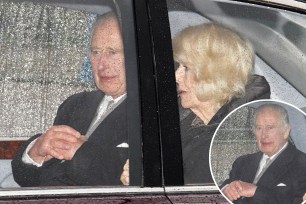 King Charles smiles as he returns to London for cancer treatment with Queen Camilla by his side