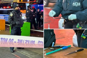 A police officer in Times Square after a migrant stabbing incident.