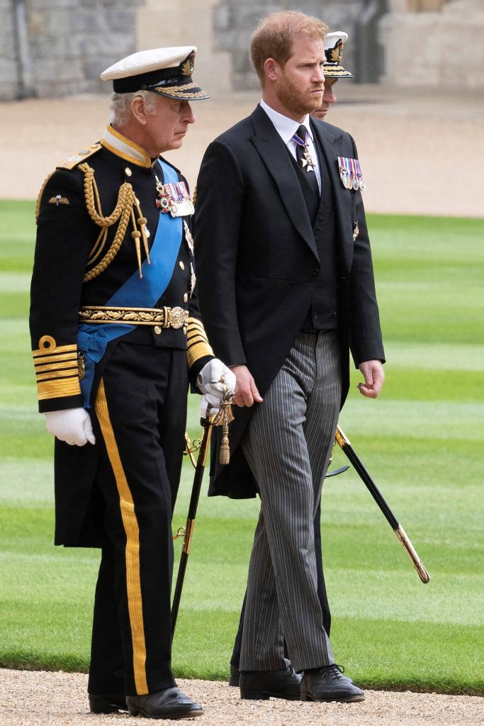 King Charles III and Prince Harry walking to St George's Chapel for Queen Elizabeth II's committal service.