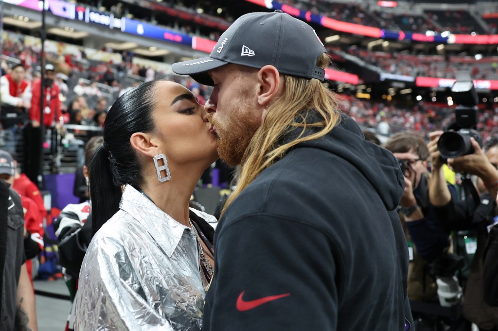 Claire Kittle kisses husband George Kittle before Super Bowl 2024 on Feb. 11, 2024.