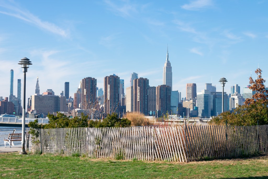 Transmitter Park in Greenpoint Brooklyn New York with a view of the Midtown Manhattan Skyline