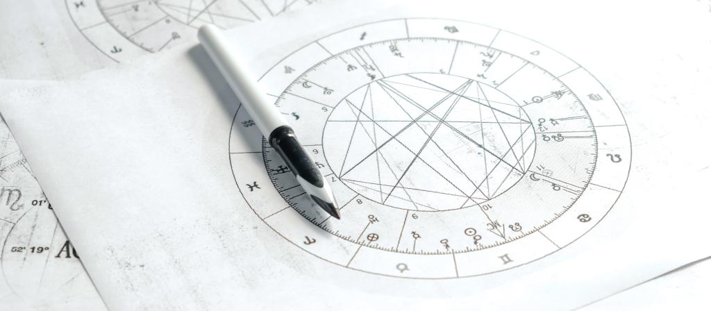 Astrology. Astrologer calculates natal chart and makes a forecast of fate.Tarot cards, Fortune telling on tarot cards magic crystal, occultism, Esoteric background. Fortune telling,tarot predictions.