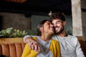 A couple embracing on a bench