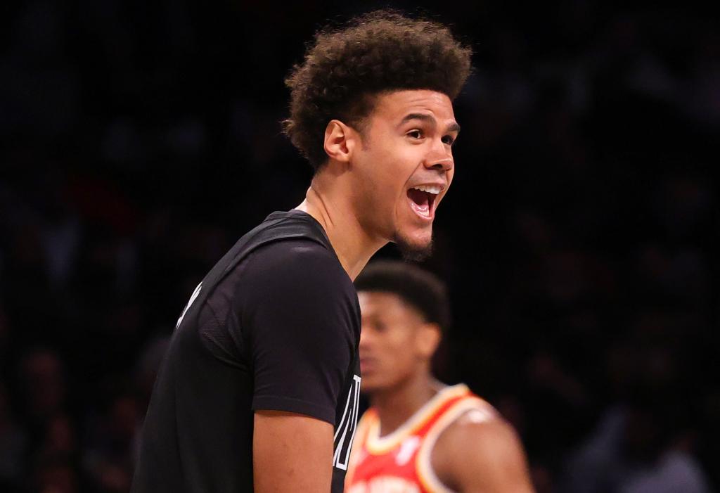 A smiling Cameron Johnson celebrates during the Nets' win over the Hawks.