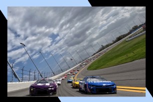 Racecars speed around the Daytona 500 track.