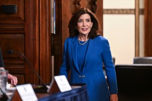 Gov. Kathy Hochul signing a bill into law, in the Red Room at the state Capitol in Albany, NY.