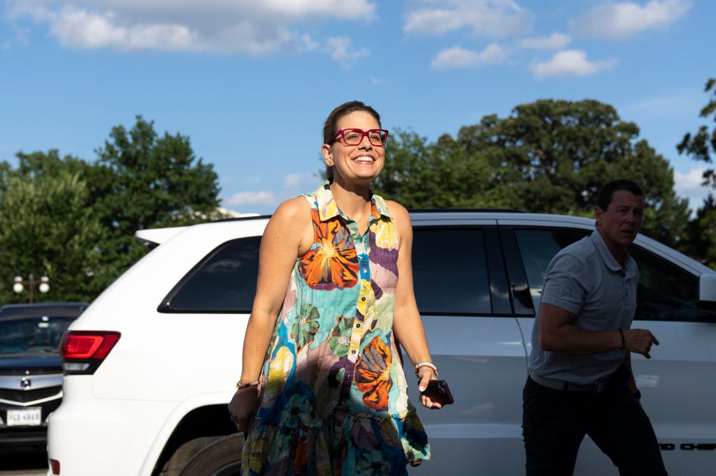 Senator Kyrsten Sinema arrives at the U.S. Capitol in Washington for a vote on a multi-trillion-dollar package.