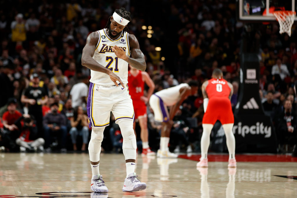 Patrick Beverley #21 of the Los Angeles Lakers mimics Damian Lillard's "Dame Time" signature gesture during the fourth quarter against the Portland Trail Blazers at Moda Center on January 22, 2023 in Portland, Oregon. 