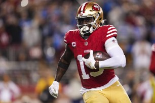 Deebo Samuel #19 of the San Francisco 49ers runs the ball during the NFC Championship NFL football game against the Detroit Lions.