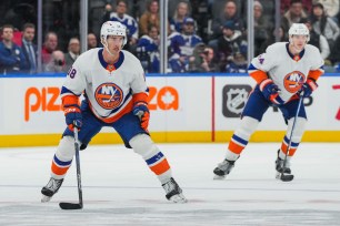 BetMGM bonus code graphic featuring New York Islanders players.