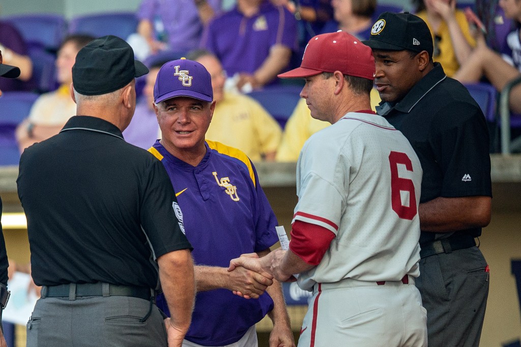 LSU Tigers head coach Paul Mainieri greets Alabama Crimson Tide head coach Brad Bohannon before a game between the Alabama Crimson Tide and the LSU Tigers on May 12, 2018.