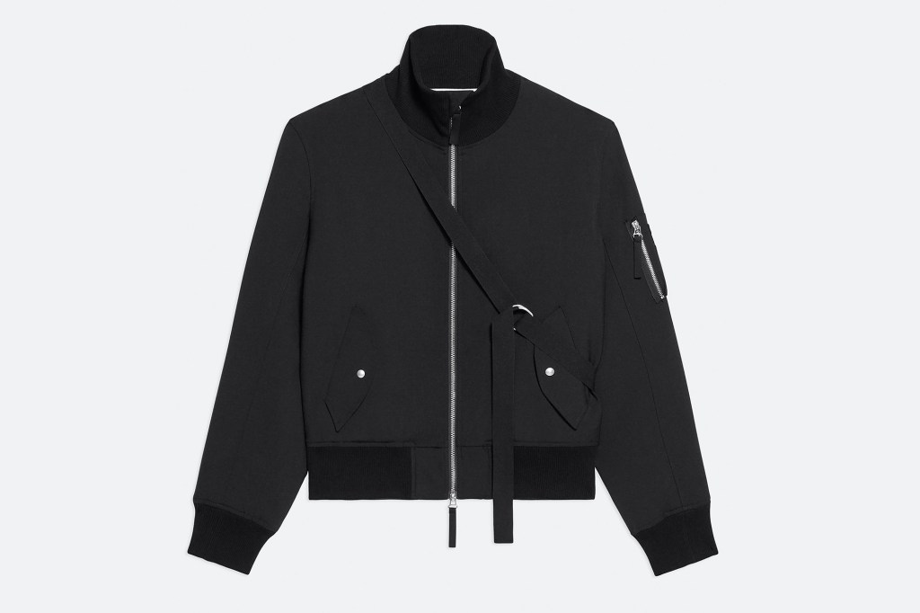 Seatbelt bomber jacket: a black jacket with a strap.