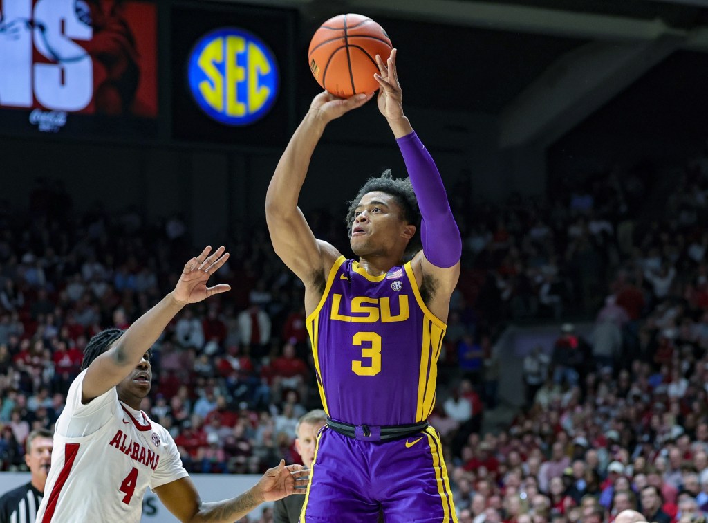Jalen Cook #3 of the LSU Tigers puts up a first half three pointer over Davin Cosby Jr. #4 of the Alabama Crimson Tide.