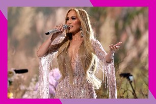 Jennifer Lopez sings onstage.