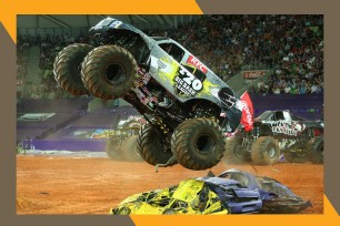 A Monster Jam truck uses smaller vehicles to catapult and fly over them.