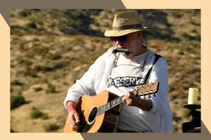 Neil Young plays guitar and harmonica at the same time onstage.