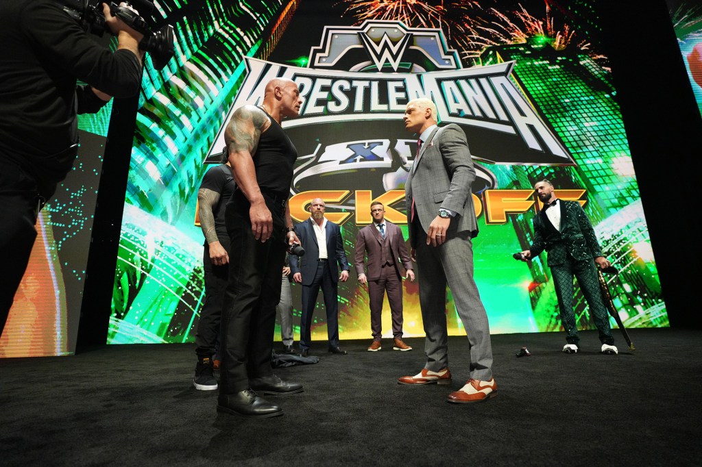 The Rock and Cody Rhodes share a moment at the WrestleMania press conference.