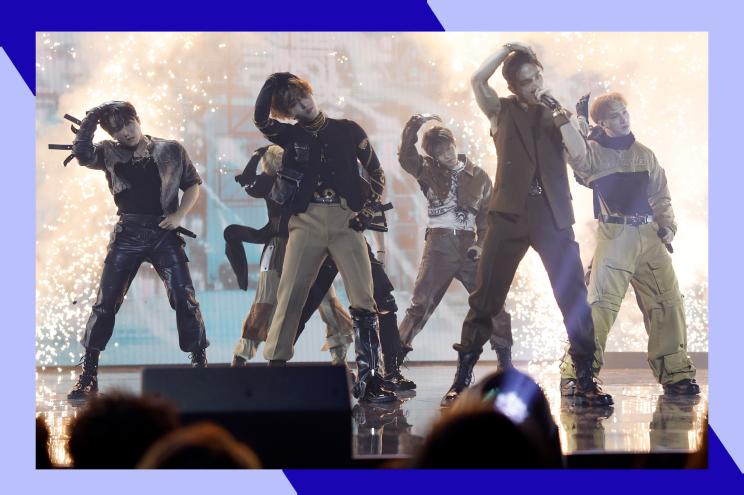 Stray Kids dances in formation onstage.