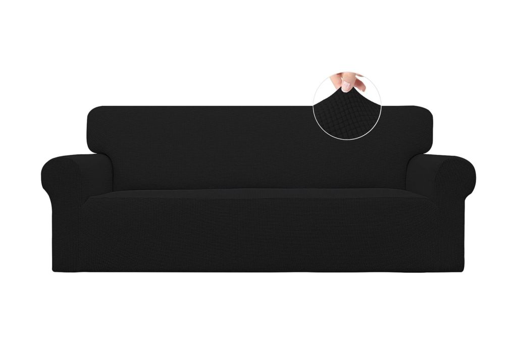 A sofa with a black slip cover