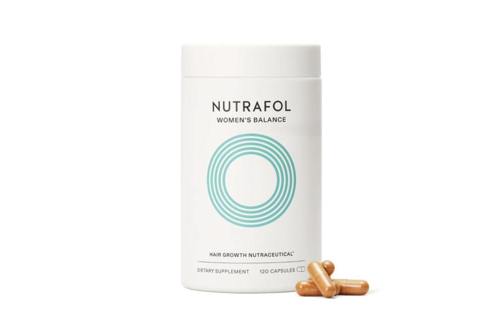 A bottle of Nutrafol supplements