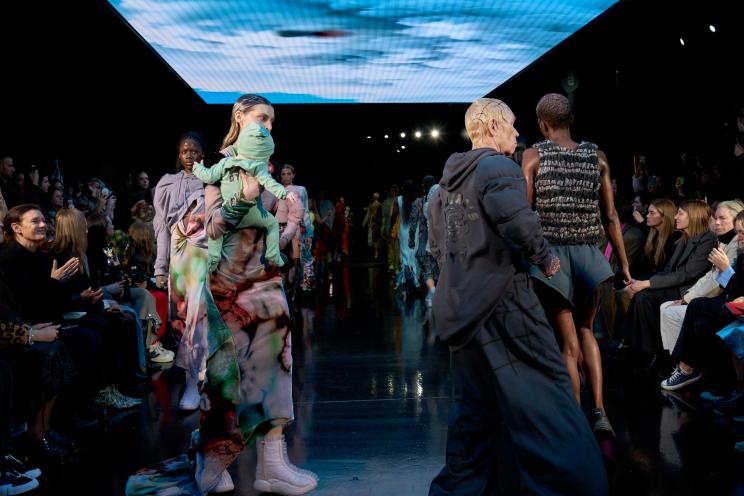 People walking down a runway during Collina Strada FW24 runway show.