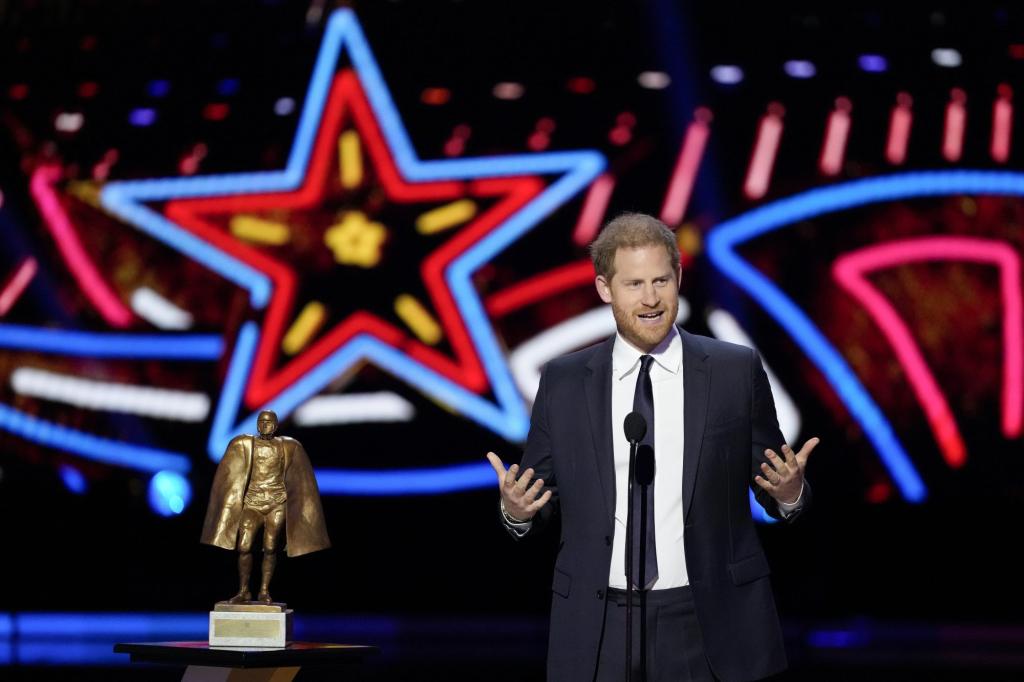 Prince Harry presenting an award in front of a microphone during the NFL Honors award show ahead of Super Bowl 58.