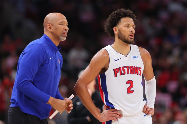 Head coach Monty Williams of the Detroit Pistons talks with Cade Cunningham #2 against the Chicago Bulls.
