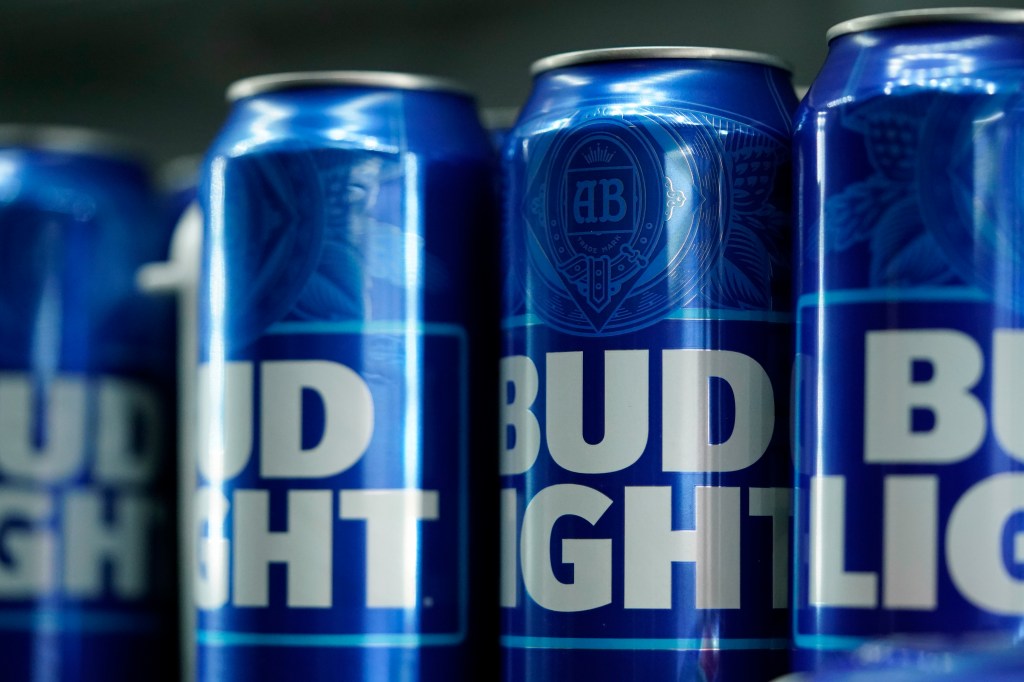 Cans of blue Bud Light beer seen before a baseball game.