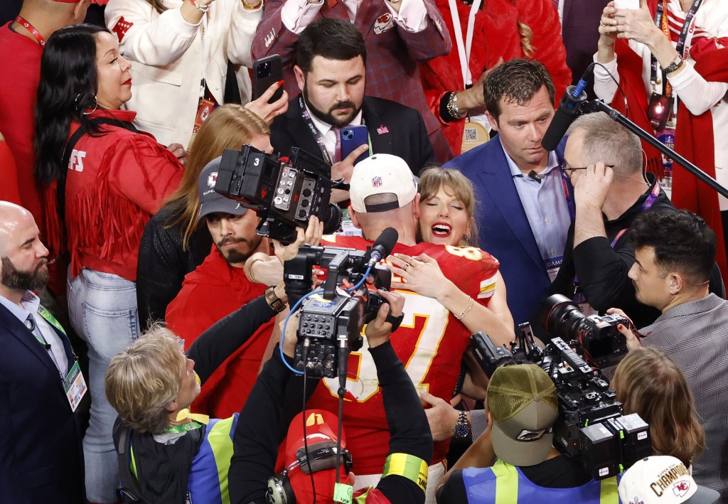 Travis Kelce celebrates with Taylor Swift during NFL Super Bowl 58 LVIII football game.