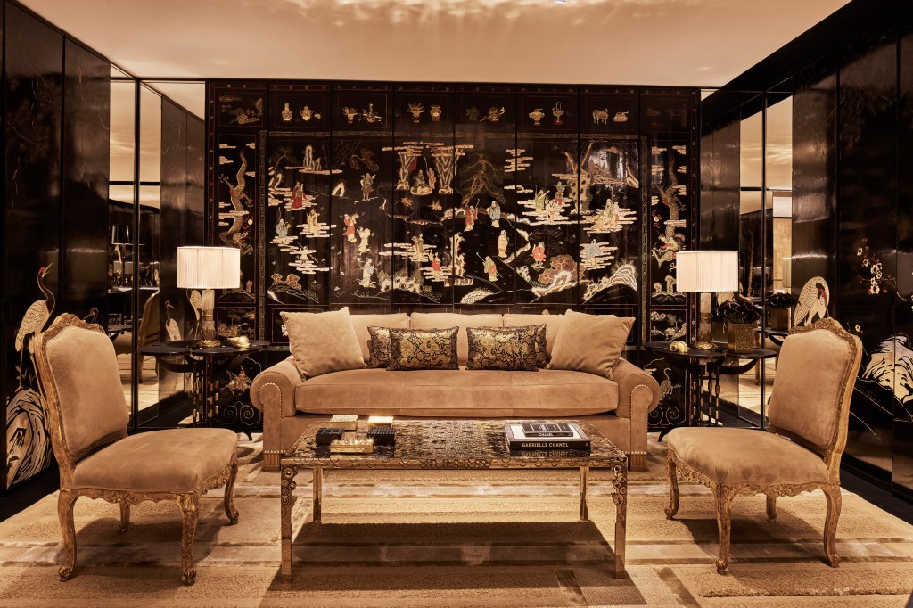 An interior image of the Chanel boutique shows plush couches and intricate wallpaper.