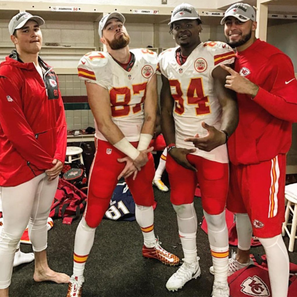 Travis Kelce, Demetrius Harris and Ross Travis celebrate the Chiefs' AFC West title in the 2016 season. 