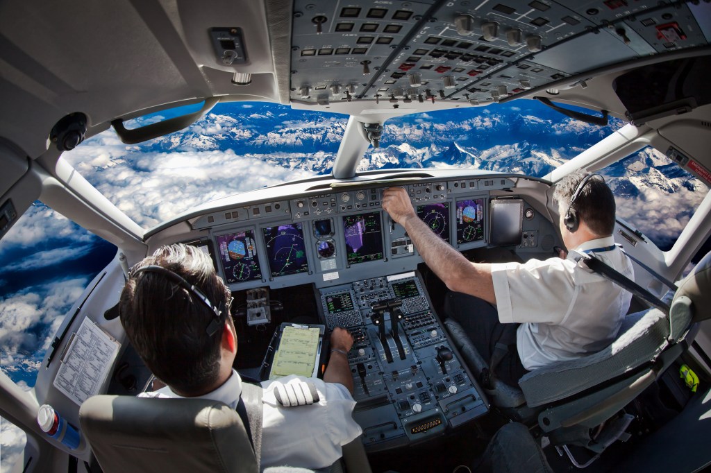 Stock photo of pilots in cockpit