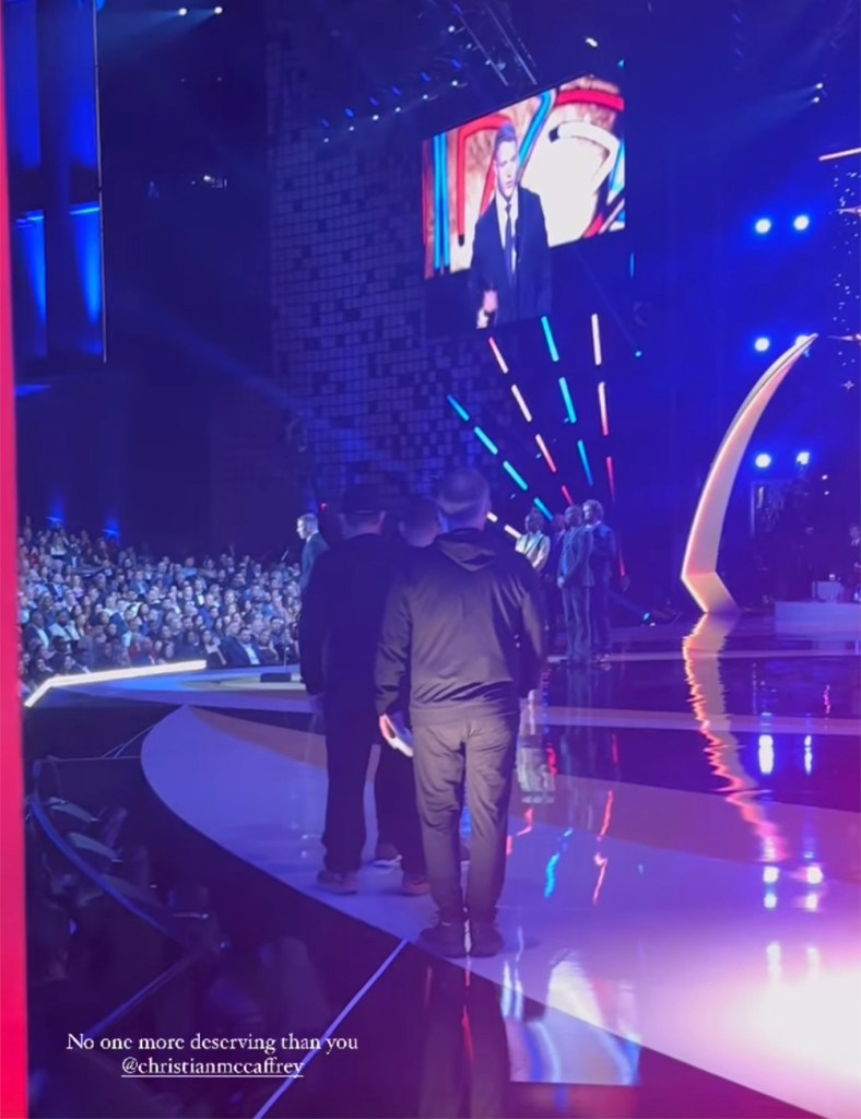 Olivia Culpo backstage while Christian McCaffrey accepts the Offensive Play of the Year award at NFL Honors in Los Angeles on Feb. 8, 2024.