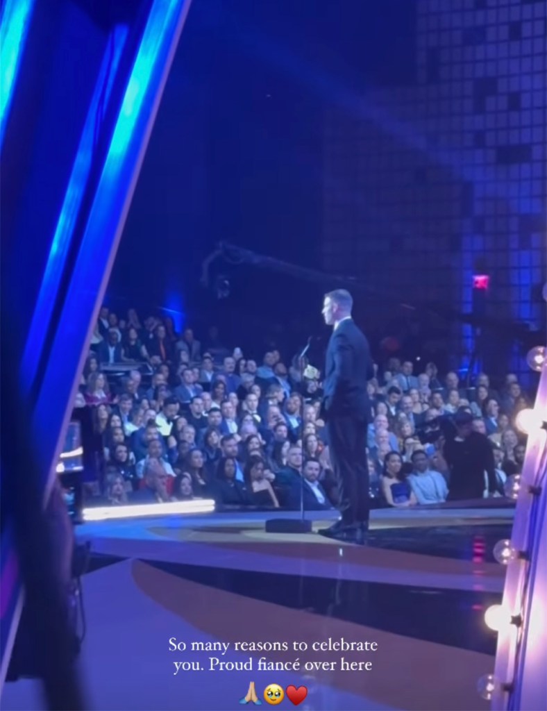 Olivia Culpo backstage while Christian McCaffrey accepts the Offensive Play of the Year award at NFL Honors in Los Angeles on Feb. 8, 2024. 