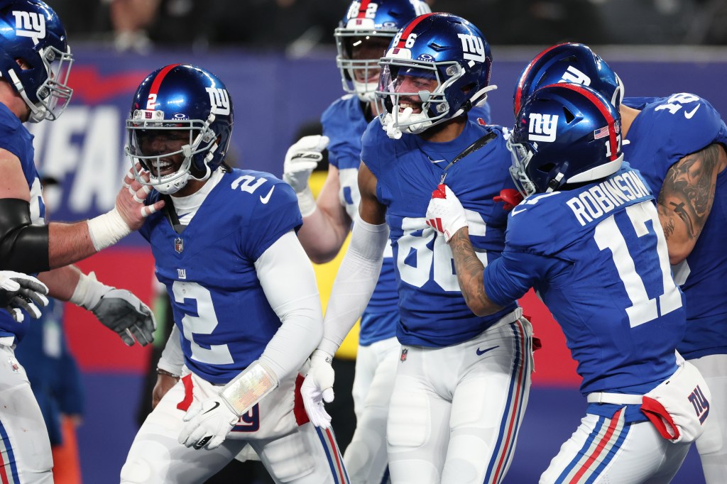 Darius Slayton celebrates after a touchdown with teammates during the second quarter against Philadelphia.