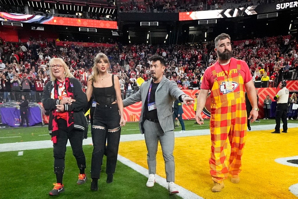 Donna Kelce, left, Taylor Swift, center, and Jason Kelce, right, celebrate after the NFL Super Bowl 58 football game between the Kansas City Chiefs and the San Francisco 49ers on Sunday, Feb. 11, 2024, in Las Vegas.  