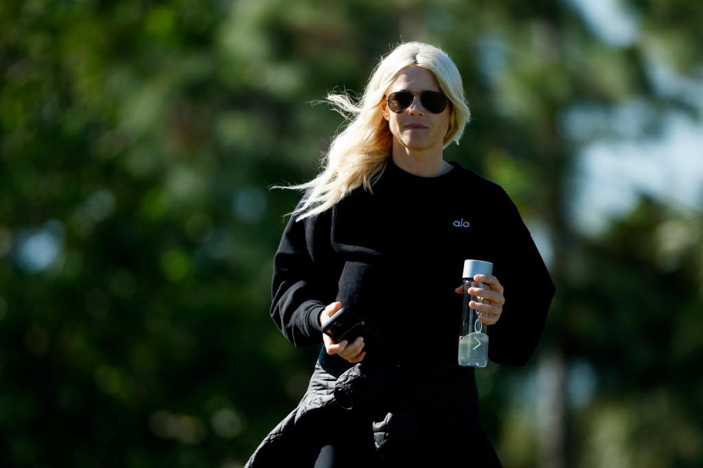 Elin Nordegren looks on as her son Charlie Woods takes part in pre-qualifying for The Cognizant Classic in The Palm Beaches at Lost Lake Golf Club.