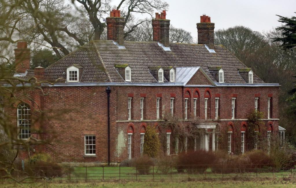 A general view of Anmer Hall, a large brick building with a fenced-in area on the Royal Sandringham Estate in Norfolk.