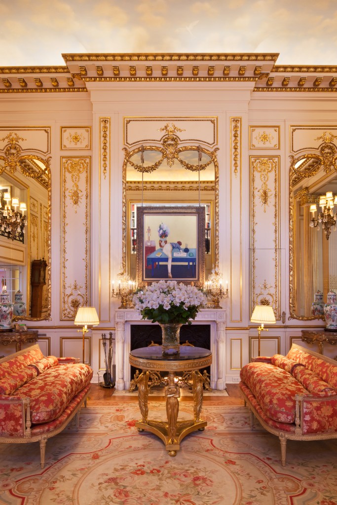 Joan Rivers' sitting room, with two sofas facing each other and a gold table between