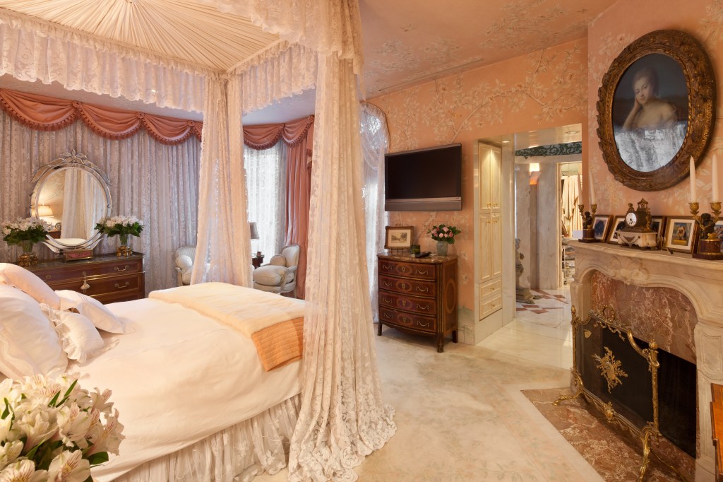 Joan RIvers' bedroom, with a camopied bed and ornate furnishings