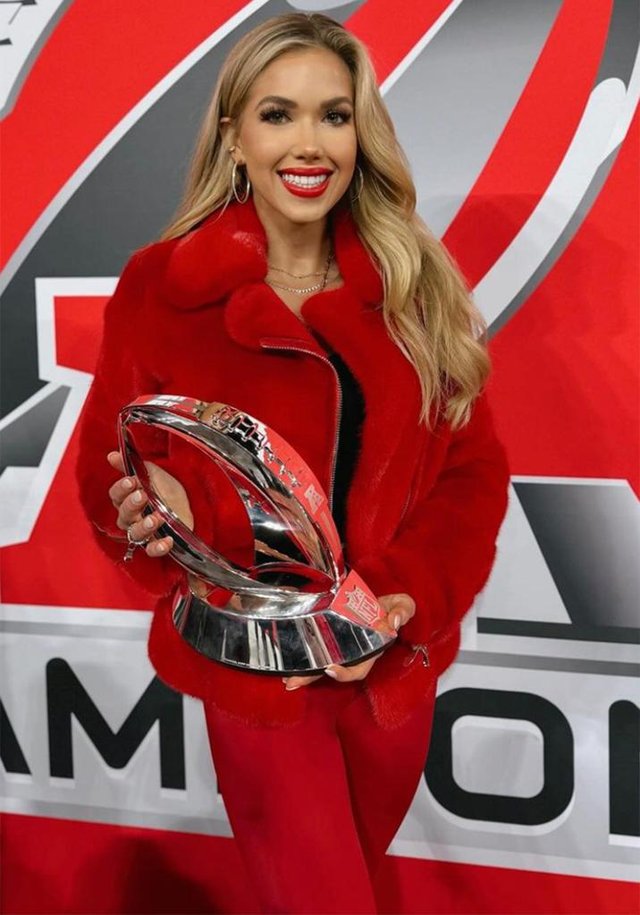 Gracie Hunt holds the Lamar Hunt Trophy after the Chiefs' AFC Championship win in January 2024.