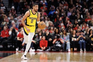 Tyrese Haliburton #0 of the Indiana Pacers dribbles in the first half of their NBA game against the Toronto Raptors.