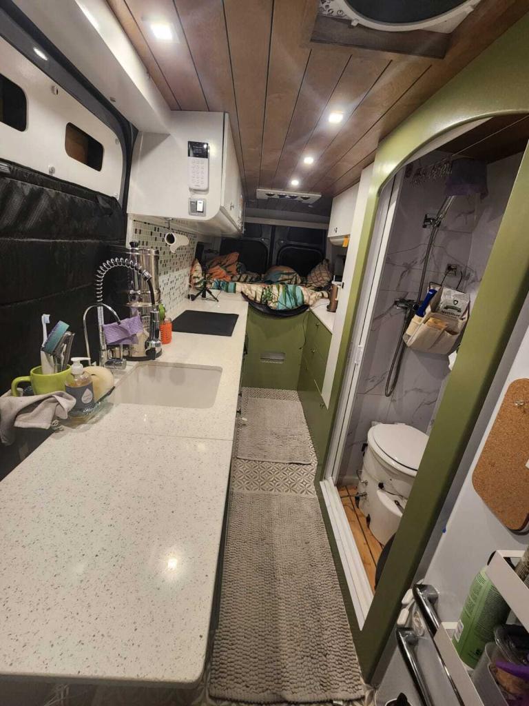 Caitlin Pyle spent $102,000.00 on renovations for her Mercedes Sprinter van that she bought for $88,000.00 — which features a custom kitchen complete with a fridge. 