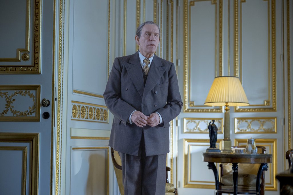 John Malkovich as Christian Dior's boss, Lucien Lelonge, who kept his workers employed during the Nazi occupation of Paris.