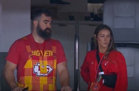 Jason Kelce and Kylie Kelce standing in a room.